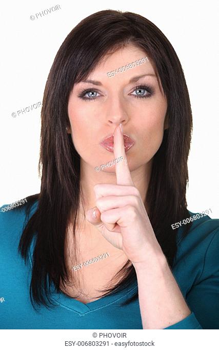Woman putting her finger to her lips asking for silence