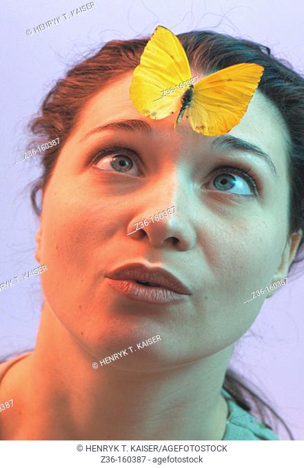 Woman with butterfly on her forehead
