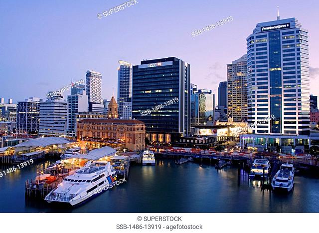 Buildings at a harbor at dusk, Auckland Ferry Terminal, Auckland, North Island, New Zealand