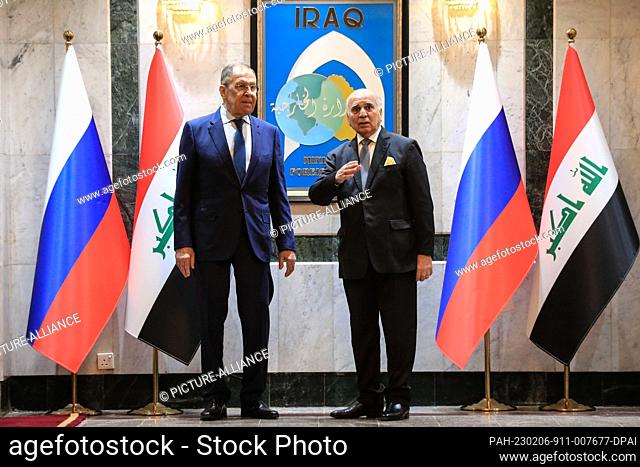 06 February 2023, Iraq, Baghdad: Iraqi Foreign Minister Fuad Hussein (R) receives Russian Foreign Minister Sergey Lavrov ahead of their meeting at the Foreign...