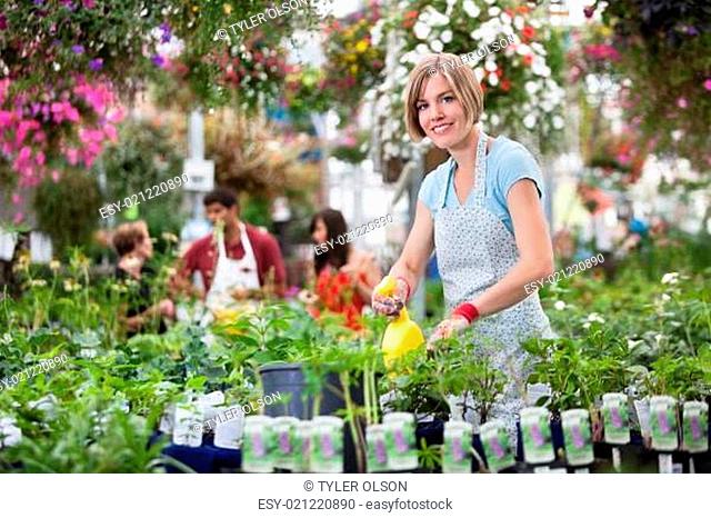 Woman Working in Greenhouse