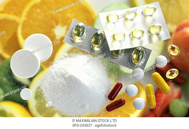 Vitamin tablets and powder, various types of fruit