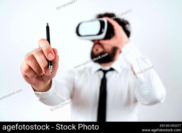 Standig Man Holding Pen To Point Important Messages And Wearing Vr Glasses
