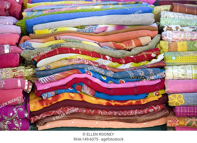 Piles of colourful scarves for sale in the Sardar Market in Jodhpur, Rajasthan, India, Asia