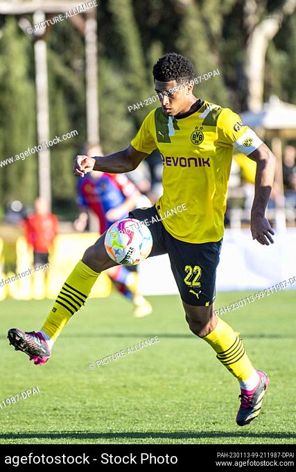 13 January 2023, Spain, Marbella: Soccer: Test matches, Borussia Dortmund - FC Basel. Dortmund's Jude Bellingham runs with the ball at his foot