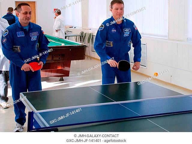 At the Cosmonaut Hotel crew quarters in Baikonur, Kazakhstan, Expedition 4243 crewmember Terry Virts of NASA (right) tries his hand at Ping-Pong Nov