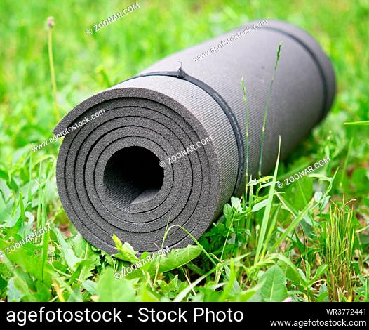 Yoga mat on the grass