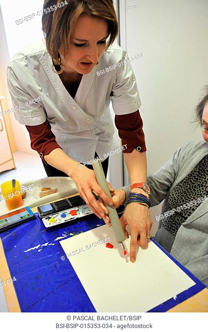 Reportage on art therapy in Ham hospital?s Alzheimer's unit, France. Art therapy sessions are offered to residents in order to maintain or rehabilitate their...