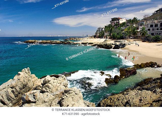 Sandy beaches with rock formations on Banderas Bay south of  Puerto Vallarta, Mexico