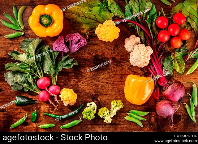 Fresh vegetables background. Healthy vegan diet banner, a flat lay. A frame with groceries and copy space