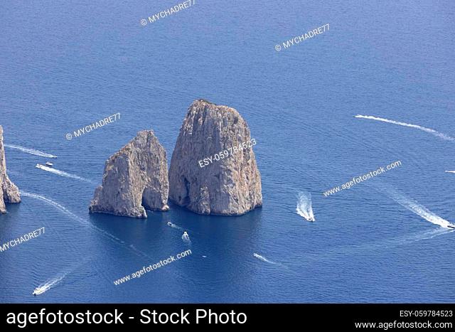 Faraglioni, attractive coastal rock formation eroded by waves, located off the coast of the island of Capri in the Gulf of Naples, Capri, Italy