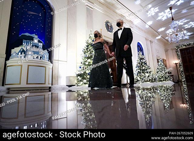 U.S. President Joe Biden and First Lady Dr. Jill Biden arrive in the Cross Hall during the Kennedy Center Honorees Reception at the White House in Washington, D