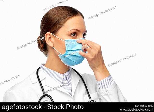 happy female doctor wearing medical mask