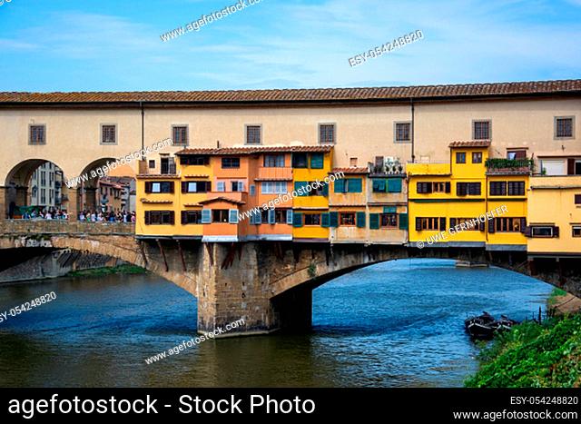 The Ponte Vecchio is a medieval stone closed-spandrel segmental arch bridge over the Arno River, in Florence, Italy