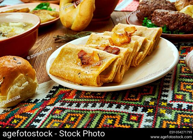 Nalysnyky, Rolled pancakes , crepes with different fillings, Ukrainian cuisine, Traditional assorted dishes, Top view