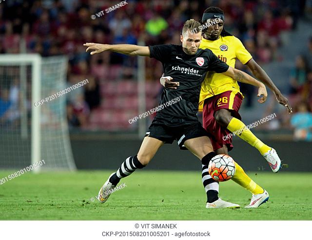 Costa Nhamoinesu from Sparta, right, and Roman Buess from Thun in action during the fourth qualifying round of the UEFA Europa League match AC Sparta Praha vs...