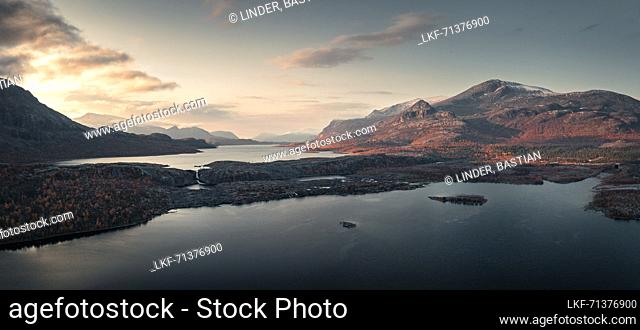 Landscape with mountains and lake in Stora SjÃ¶fallet National Park in autumn in Lapland in Sweden from above