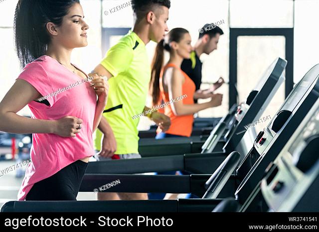 Healthy woman on treadmill at gym