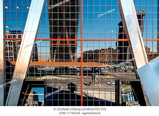 Madrid, Spain - March 20, 2017: Low angle view of The Gate of Europe towers and reflections. They are twin office buildings designed by architect Philip Johnson