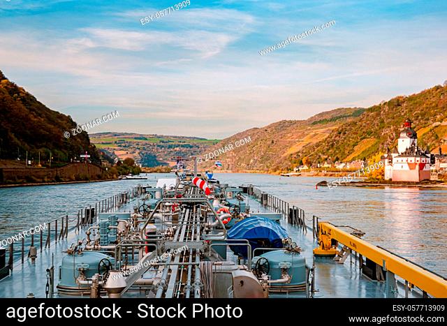 Binnenvaart, Translation Inlandshipping on the river rhein in Germany during sunset hours, Gas tanker vessel rhine river oil and gas transport Germany near...
