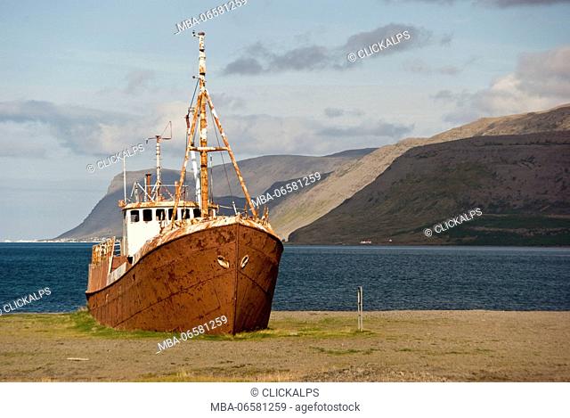 An abandoned fishing boat Grimsby Epine, it's aground on north coast of Iceland, near the sea in the area of fjords, Iceland