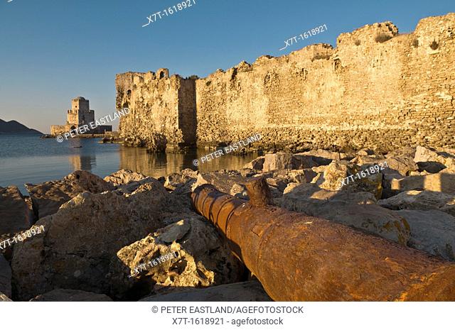 Sunrise on the Venetian walls of Methoni fortress and the Bourtzi tower a small fortified island, Methoni, Messinia, Southern Peloponnese Greece  The tower was...