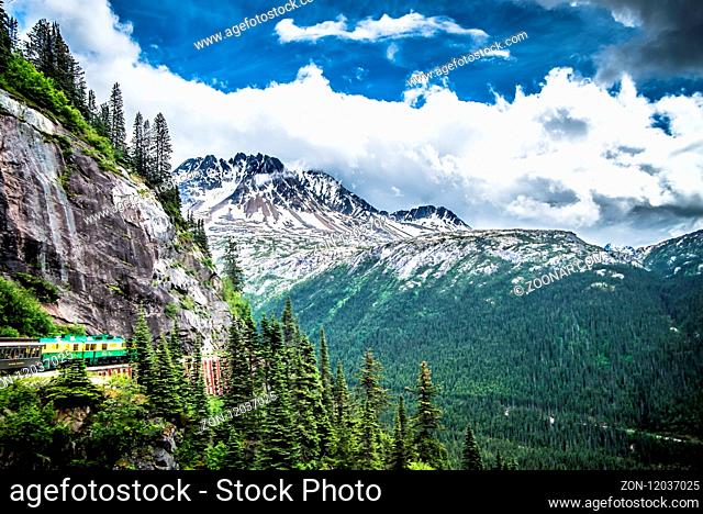 The White Pass and Yukon Route on train passing through vast landscape
