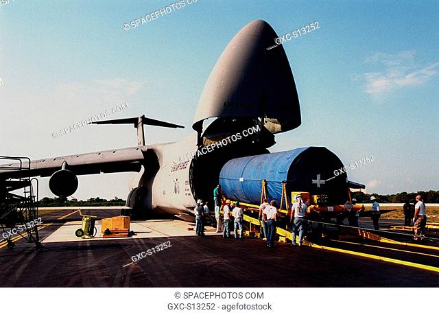 04/06/1999 --- At Cape Canaveral Air Station, workers begin offloading a Centaur upper stage from a U.S. Air Force C-5c. After being mated with the Atlas IIA...