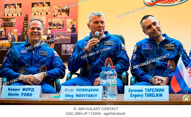 Expedition 3334 Flight Engineer Kevin Ford of NASA, left, Soyuz Commander Oleg Novitskiy and Flight Engineer Evgeny Tarelkin of ROSCOSMOS, right