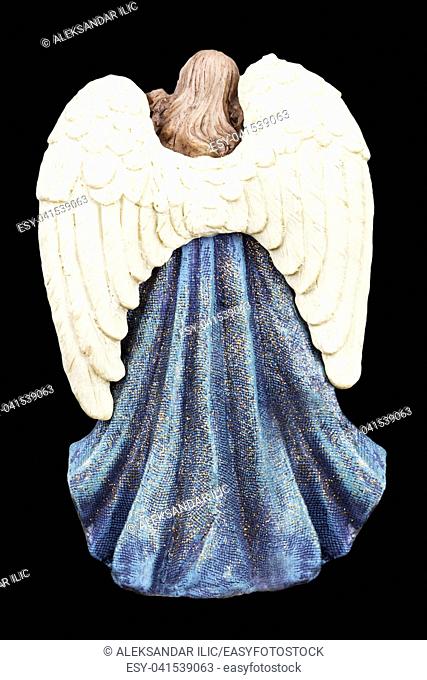 Angel With White Wings Standing Isolated On Black Background