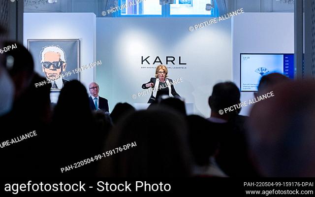 04 May 2022, North Rhine-Westphalia, Cologne: Caroline Lang, auctioneer, acts at the auction of the third part of the estate of fashion designer Karl Lagerfeld...