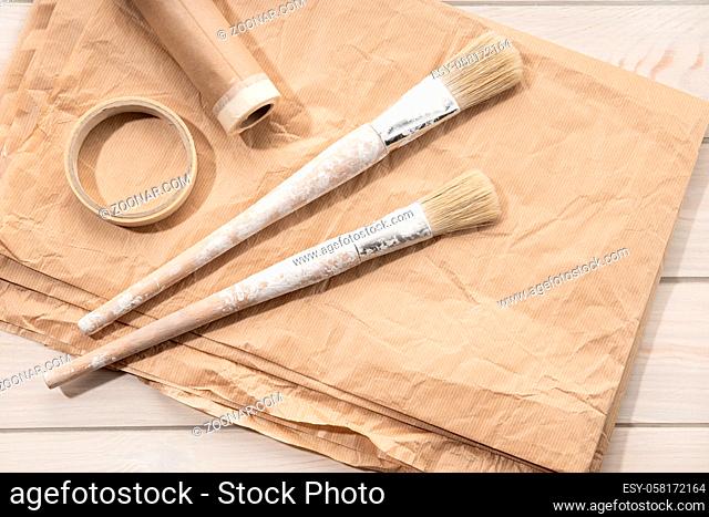 Set of painting tools brushes, masking tape, paper. DIY Home Improvement Paint. Top view. Copy space