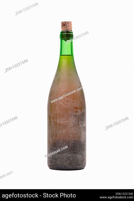 Old bottle of wine, covered in dust, isolated on white