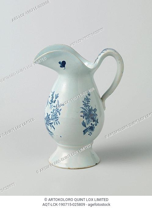 Lamp jug painted with flowers Lamp jug of blue painted faience on a light blue background. The jug is egg-shaped, has a wide lip