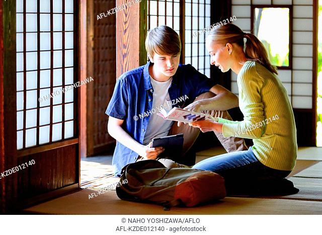 Caucasian couple at traditional Japanese house