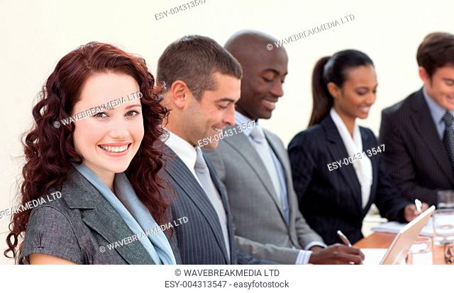 Smiling beautiful businesswoman in a meeting
