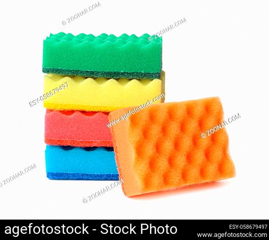 Stack of colorful plasdtic dishwashing sponges isolated on white