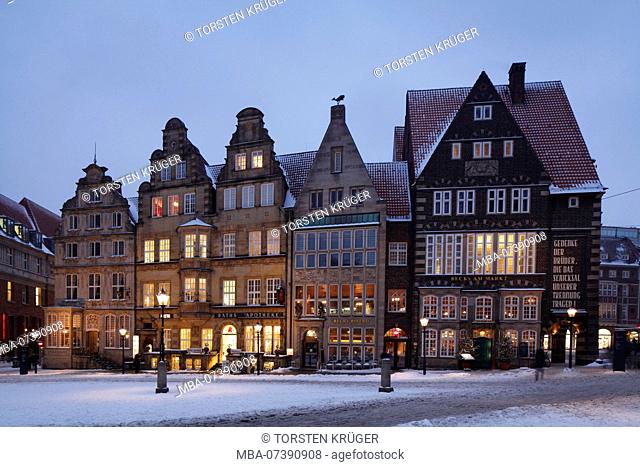 Historic row of houses with snow at the market square with market square West side at dusk, Bremen, Germany, Europe
