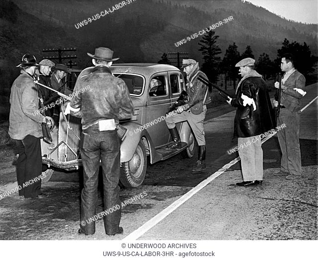 Verdi, Nevada: October 10, 1938.A group of armed possemen stopping motorists coming into Nevada near the state line on Highway 50