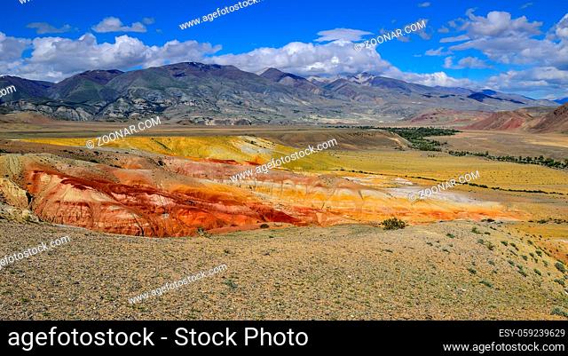 View of unrealy beautiful colorful clay cliffs in Kyzyl-Chin (Kisil-Chin) valley, Altai mountains, Russia. Summer landscape