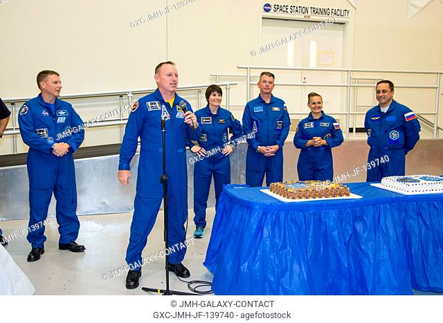 NASA astronaut Barry Wilmore, Expedition 41 flight engineer and Expedition 42 commander, speaks to a crowd during an Expedition 4243 cake-cutting ceremony in...