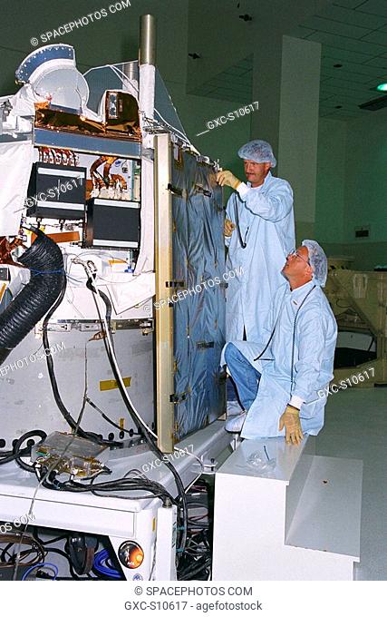 07/22/1997 --- Applied Physics Laboratory Engineer Cliff Willey kneeling and Engineering Assistant Jim Hutcheson from Johns Hopkins University install solar...