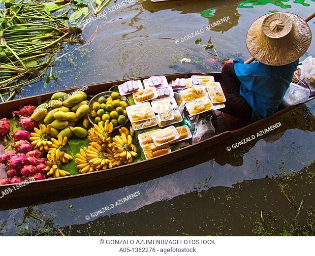 Fruit seller in the Damnoen Saduak floating market, 100 km away from Bangkok Thailand
