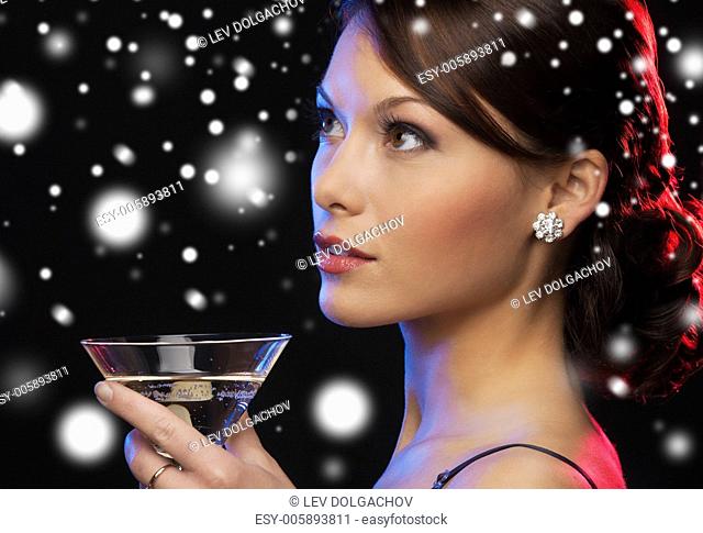 luxury, vip, nightlife, party, christmas, x-mas, new year's eve concept - beautiful woman in evening dress with cocktail