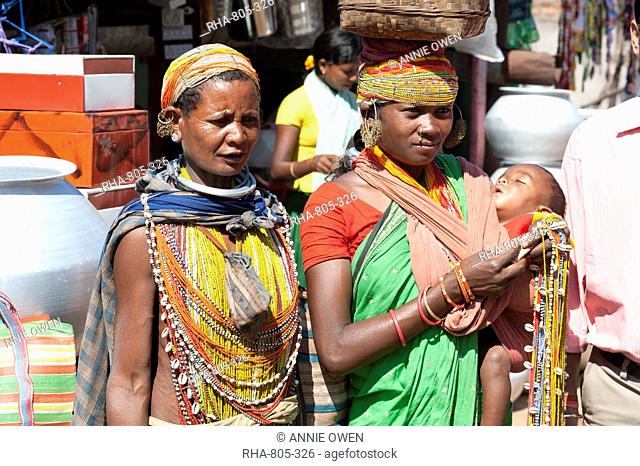 Two Bonda tribeswoman and baby in traditional bead costume and necklaces wearing contemporary costume, beaded caps and earrings, Rayagader, Orissa, India, Asia