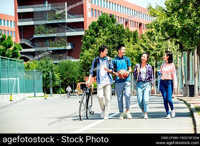 Happiness of college students walking in the campus