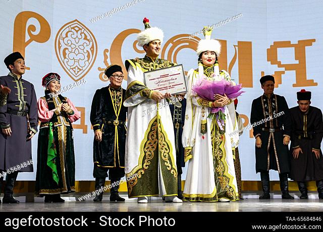 RUSSIA, MOSCOW - DECEMBER 12, 2023: Sanal Nayminov and his bride Erkina Muchkayeva enjoy a traditional wedding on Kalmykia Republic Day as part of the Russia...