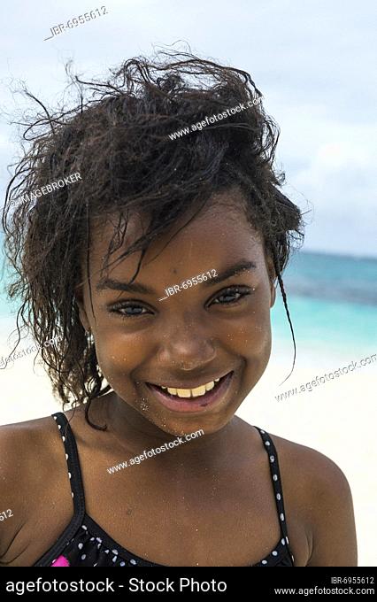 Pretty young local girl, on the world class Shoal Bay East beach, Anguilla, Caribbean, British Oversea territory, United Kingdom, Europe