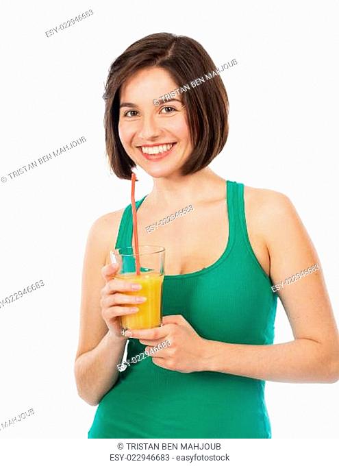 Beautiful brunette drinking an orange juice