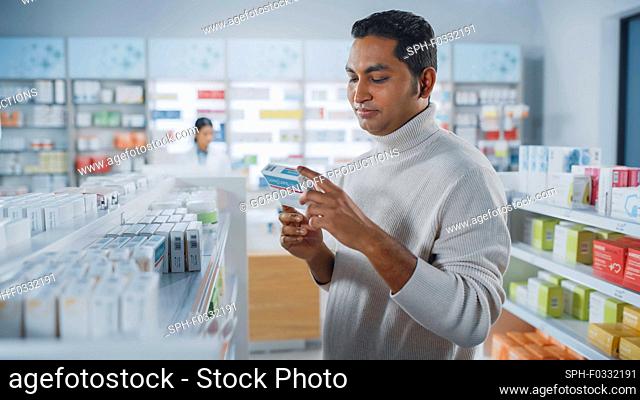 Customer browsing medicines in a pharmacy